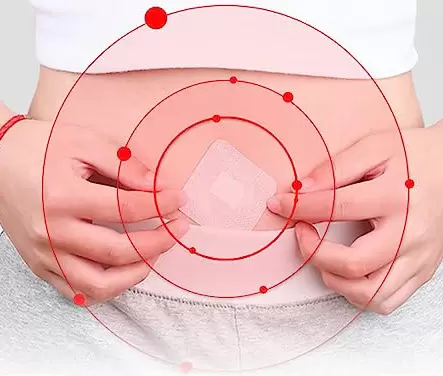Woman applying BellyButtonBliss patch on tummy for natural weight loss support
